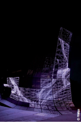 FRAC Orléans turbulences. Les paeaux facettés qui habillent le bâtiment constituent une peau en aluminium, verre et LED qui diffuse des flux d’informations en perpétuel changement. Ainsi, la surface du bâtiment se nourrit de ces images-lumière réalisées par Electronic Shadow. Architecte : Jakob + MacFarlane - Conception lumière : Naziha Mestaoui, Yacine Aït Kaci Electronic Shadow.